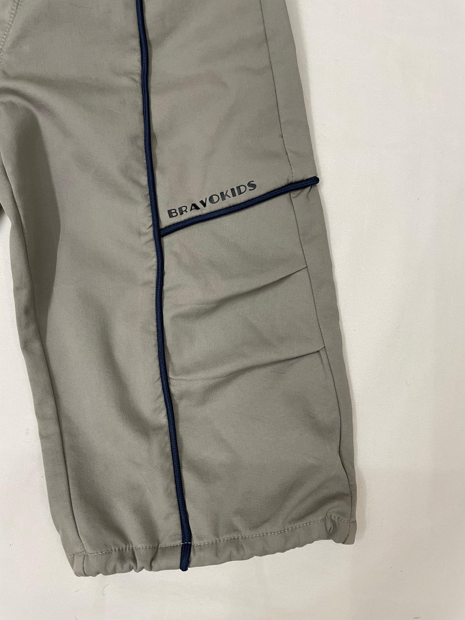 Side detail of green drop crotch pants for kids by Little Aangan