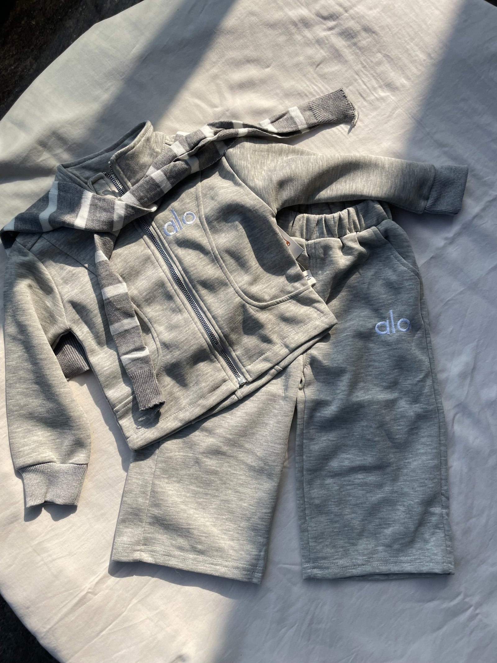 Close-up detail of unisex grey track set for kids by Little Aangan
