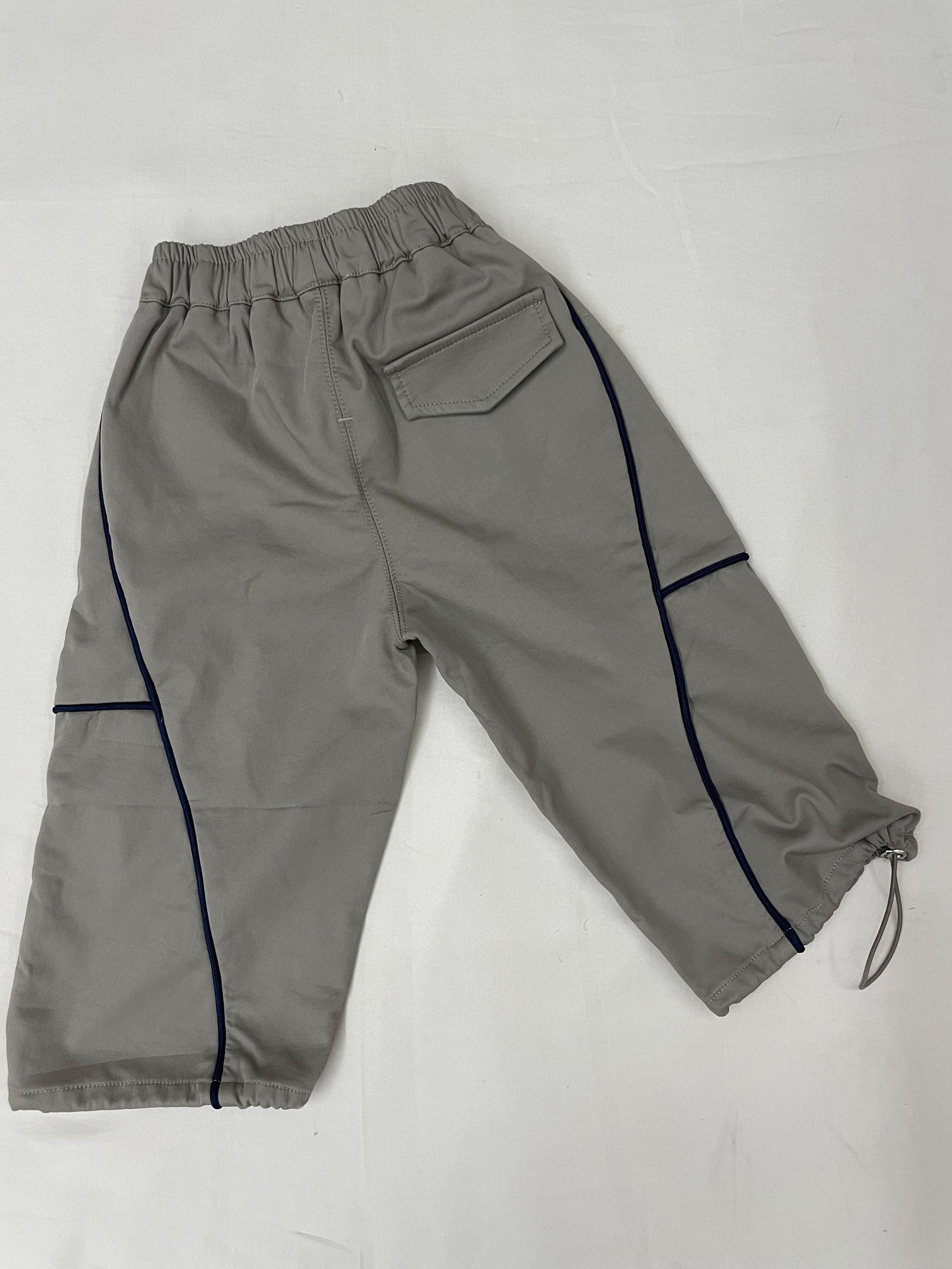 Front view of green drop crotch pants for kids by Little Aangan
