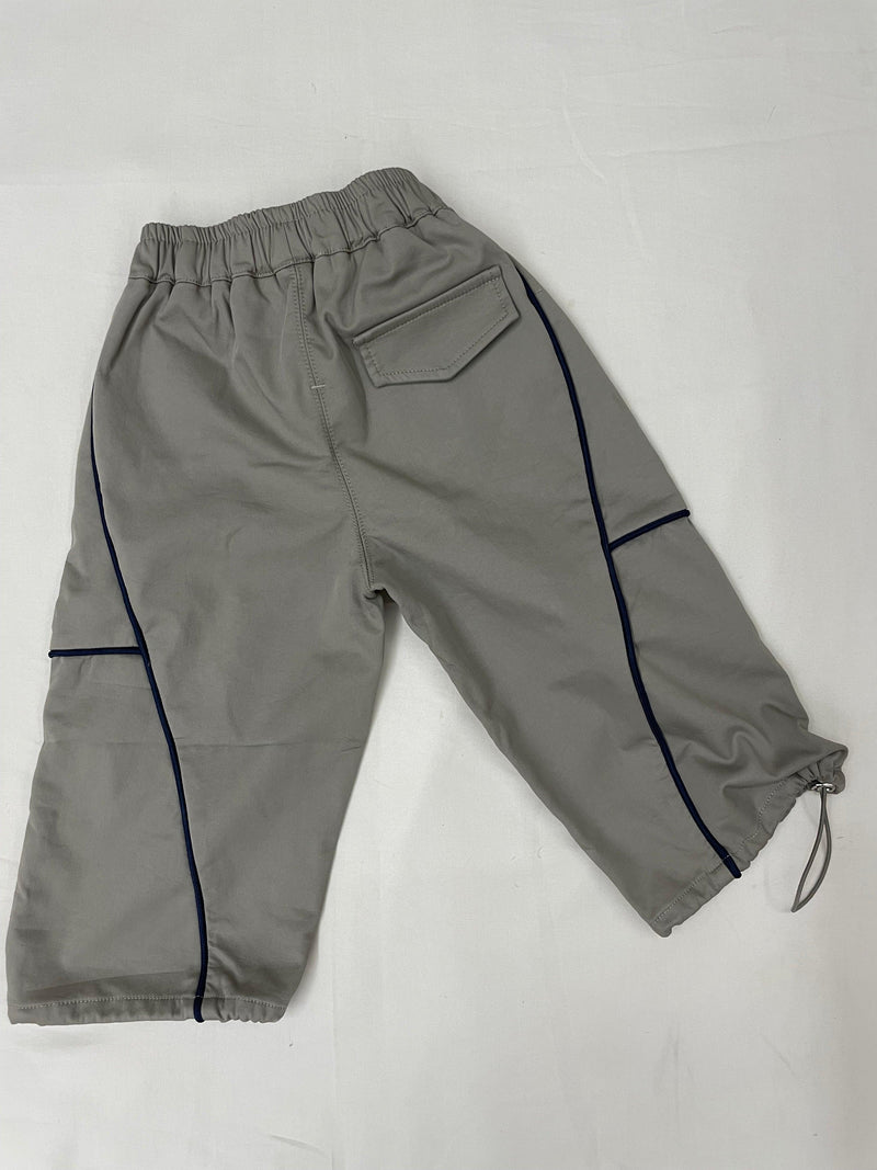 Front view of green drop crotch pants for kids by Little Aangan