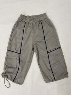 Kids streetwear outfit styled with green drop crotch pants by Little Aangan