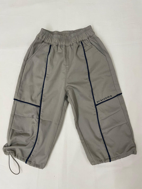 Kids streetwear outfit styled with green drop crotch pants by Little Aangan