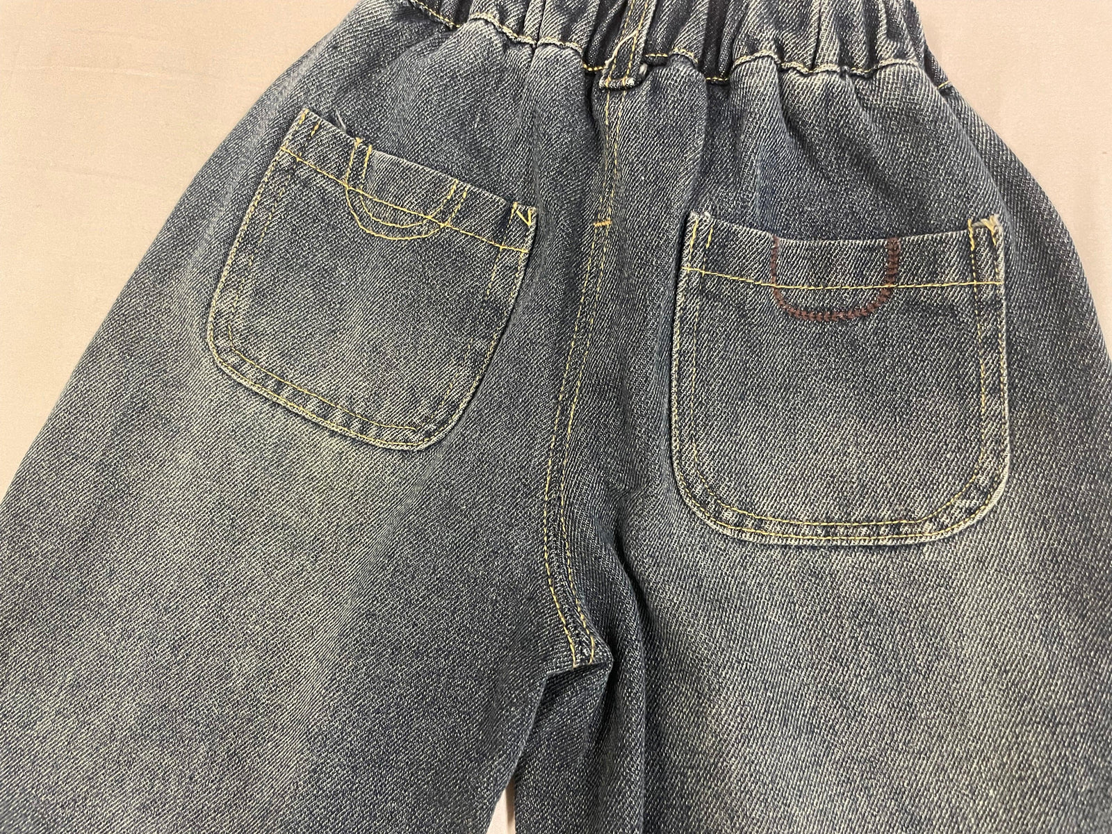 Side detail of blue Korean denim pants for kids by Little Aangan